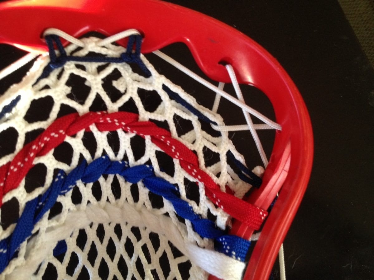 Around the back of the top string hole and down to the second sidewall hole. 