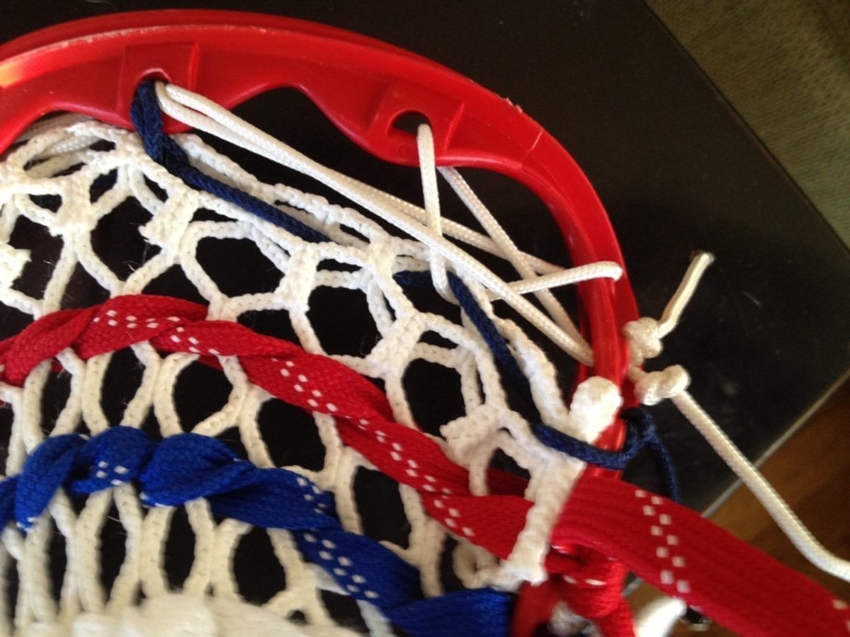 Run the top string through the second sidewall hole and tie it off.  